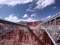 T/L Clouds floating over Navajo Bridge / Marble Canyon, Arizona, United States Stock Footage