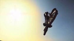 HD Super Slow-Mo: Dirt Biker Jumping Over Camera Stock Footage