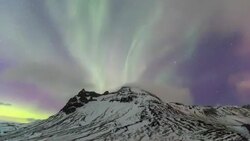 HD Time Lapse : Northern Lights over mountains Stock Footage