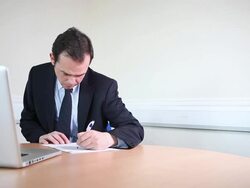 Male lawyer writing contracts Stock Footage