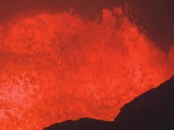 Waves of lava splash into crater's edge at night, Marum Volcano, Ambrym Island, Vanuatu Stock Footage