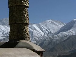 MS TU Shot of corner of building with mountain topped with snow / Lhasa, Tibet, China Stock Footage