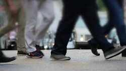 business people commuting on crowded street in the city. new york rush hour scene of anonymous pedestrians walking Stock Footage