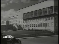 1943: SWEDEN: SCHOOL: WS City school. DENTAL CLINIC: LS Patients in row of dental chairs. Female dentist working on child's teeth. MS Child smiling. POWER: XWS Hydroelectric power plant & dam. WS Open dam locks w/ water flowing. Government sponsored Instructional Video