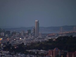 MS PAN Bay bridge, and treasure Island and downtown san francisco at twilight / San Francisco, California, United States Stock Footage