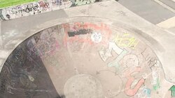 Skateboarder Riding a Bowl at Skatepark Stock Footage