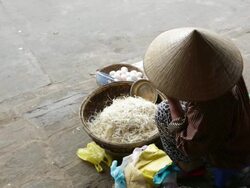 WS Woman eating and selling beansprouts and eggs  Stock Footage
