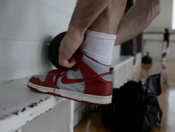 MS Young man tying shoe-laces of  his tennis shoes / Minneapolis, Minnesota, United States  Stock Footage