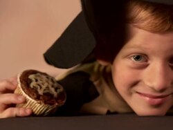 HD DOLLY: Portrait Of A Boy Holding Halloween Pastries Stock Footage