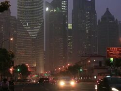 Wide road and high buildings at night Stock Footage
