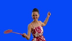 young beautiful woman with swatter smiling on a blue screen . Stock Footage