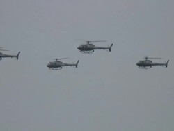 (HD1080i) Military, Police, Security Helicopters Flying in Formation Past Trees Stock Footage