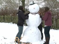 WS women building snowman / Saarburg, Rhineland-Palatinate, Germany Stock Footage