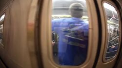 WS subway train picks up speed  camera sees passengers through doors   windows  train leaves the station Stock Footage