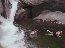 MS PAN Shot of Couple swimming in swimming hole on beautiful summer day in Northern / Maine, United States Stock Footage