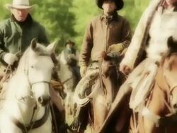 Three Cowboys riding horseback Stock Footage