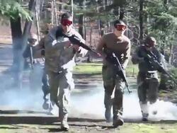 A military group practices a drill. - Model Released - HD Stock Footage