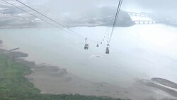 Cable car riding on the sky and heading to the station. Stock Footage