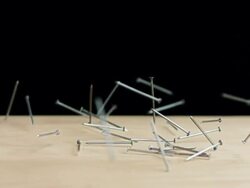 HD Super Slow-Mo: Nails Falling On A Table Stock Footage