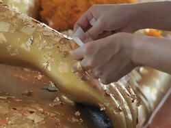 Putting gold leaf Stock Footage