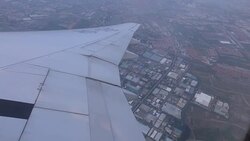 Airplane flying over city Stock Footage