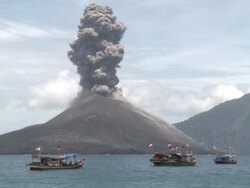 Large explosive eruption at Anak Krakatau with fishing boats nearby, Krakatoa, Indonesia, November 2010 Stock Footage