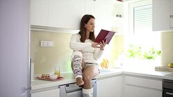 Reading in the kitchen Stock Footage