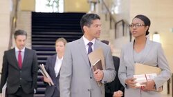 Judges and lawyers walking in courthouse Stock Footage