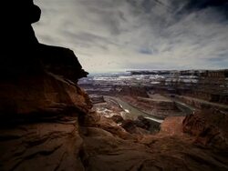 WS T/L PAN View of Geese flying over Red Rock Canyon dusted with snow / Canyonlands NP, Utah, United States Stock Footage