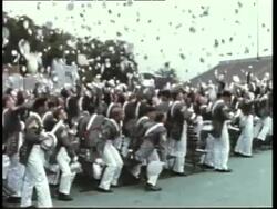 West Point cadets throw their hats into the air during graduation ceremonies. News Clip