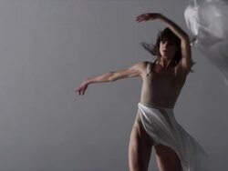 woman with silk draped around her dancing Stock Footage
