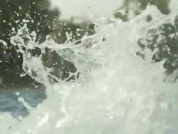 Slow motion boy jumps into pool past camera, in background two boys play ball, Spain (Individual frames may also be used as a still image. Each frame in its raw state is about 6MB or about 12MB as a 16 bit TIFF) Stock Footage