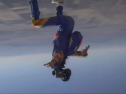 Skydiver sit-fly's with a camera helmet Stock Footage