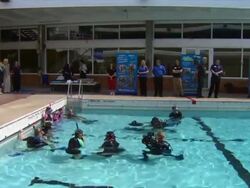 CLEAN: Exterior shots Prince William snorkeling with young BSAC members in swimming pool. News Clip