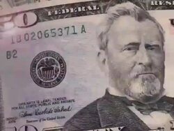 (Loop) Close-up US Currency with Rays Stock Footage