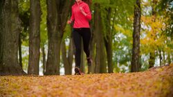 Woman jogging in park Stock Footage