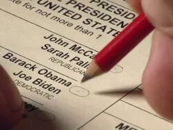 2008 CU hand using pencil to vote for John McCain and Sarah Palin on US presidential ballot / pencil moves between choices before deciding Stock Footage
