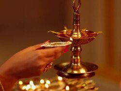 Close-up of a woman hand burning oil lamp Stock Footage