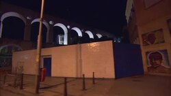 Pedestrians stroll near the Carioca Aqueduct in Rio de Janeiro's Lapa neighborhood at night. Stock Footage