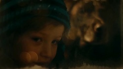 Boy spying on Santa-Claus distributing presents under christmas tree Stock Footage