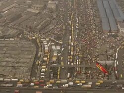 WS AERIAL View above city and traffic moving on street / Lagos, Nigeria Stock Footage