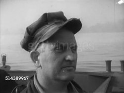1952: MONONGAHELA RIVER: VS HAZY Morgantown in West Virginia, Captain Bill Cunningham in pilot house, fog over barges w/ coal, Pat Gainer on forward watch on barge through fog, hand signaling, navigating through fog. Upstream, steel industry Instructional Video