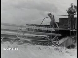 Farmers harvesting bagging grain Instructional Video