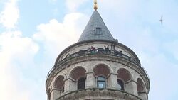 CLEAN : Turkish daredevil jumps from Istanbul's Galata Tower News Clip