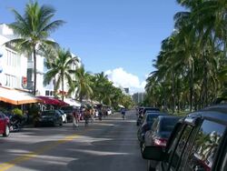 South Beach Miami Ocean Drive morning bike riders and skate boaders Stock Footage
