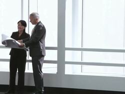  WS Business associates studying blueprint then parting ways / Seattle, Washington, United States Stock Footage