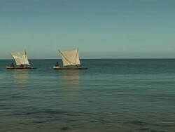  WS ZO Indigenous people on handmade sailboats drift off on  coast of Madagascar/ Madagascar Stock Footage