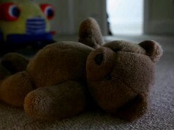 Man entering child's room, teddy bear on the floor. Stock Footage