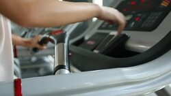 sport women jogging on treadmill cardio equipment Stock Footage