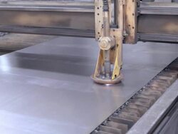 computer controlled plasma cutting machine punches precision holes into sheet metal using high-frequency high-voltage sparks as moving torch head produces clean sharp cuts / Redlands, California, USA Stock Footage